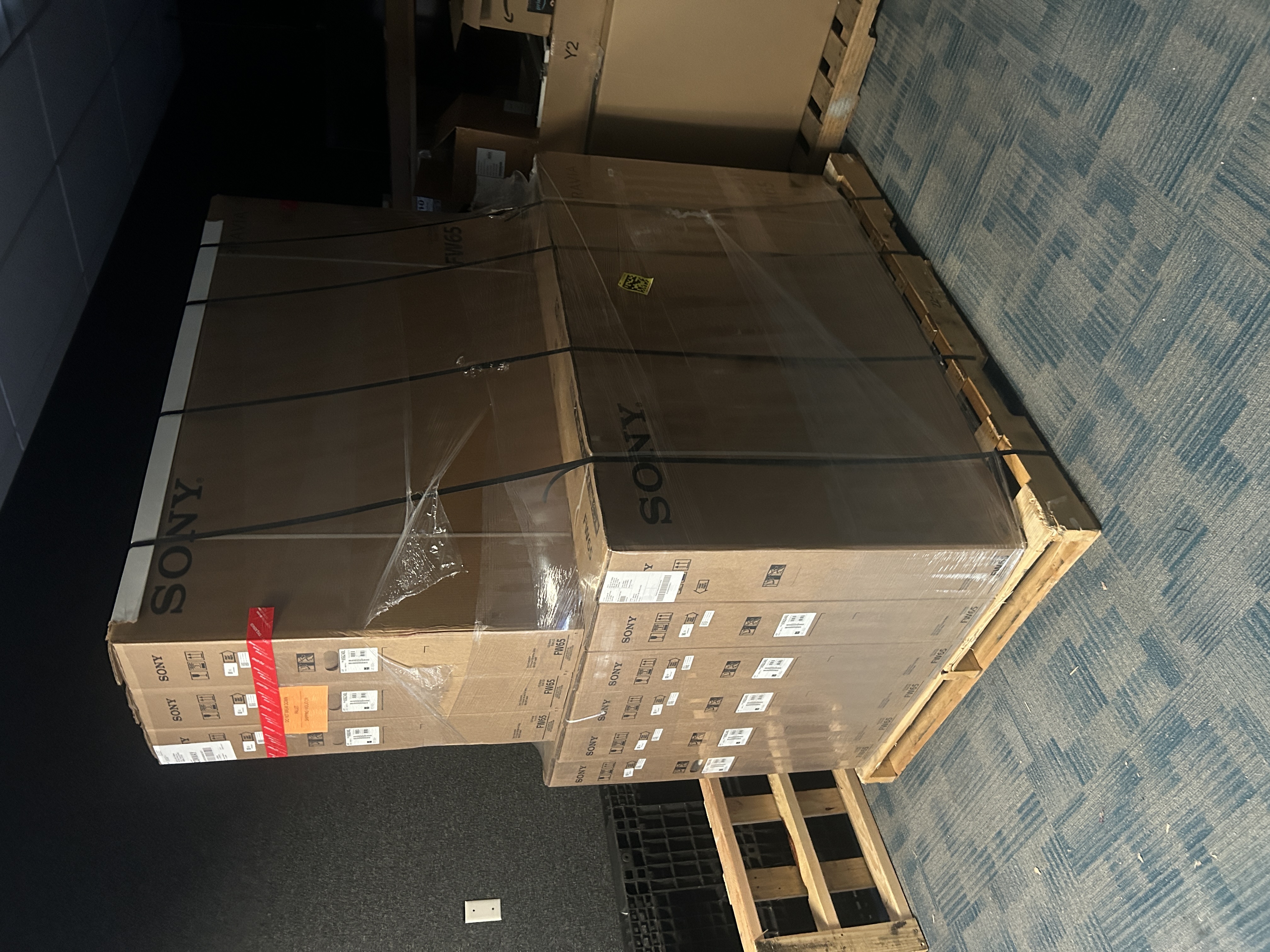 A large delivery of displays staged for campus classroom deployment