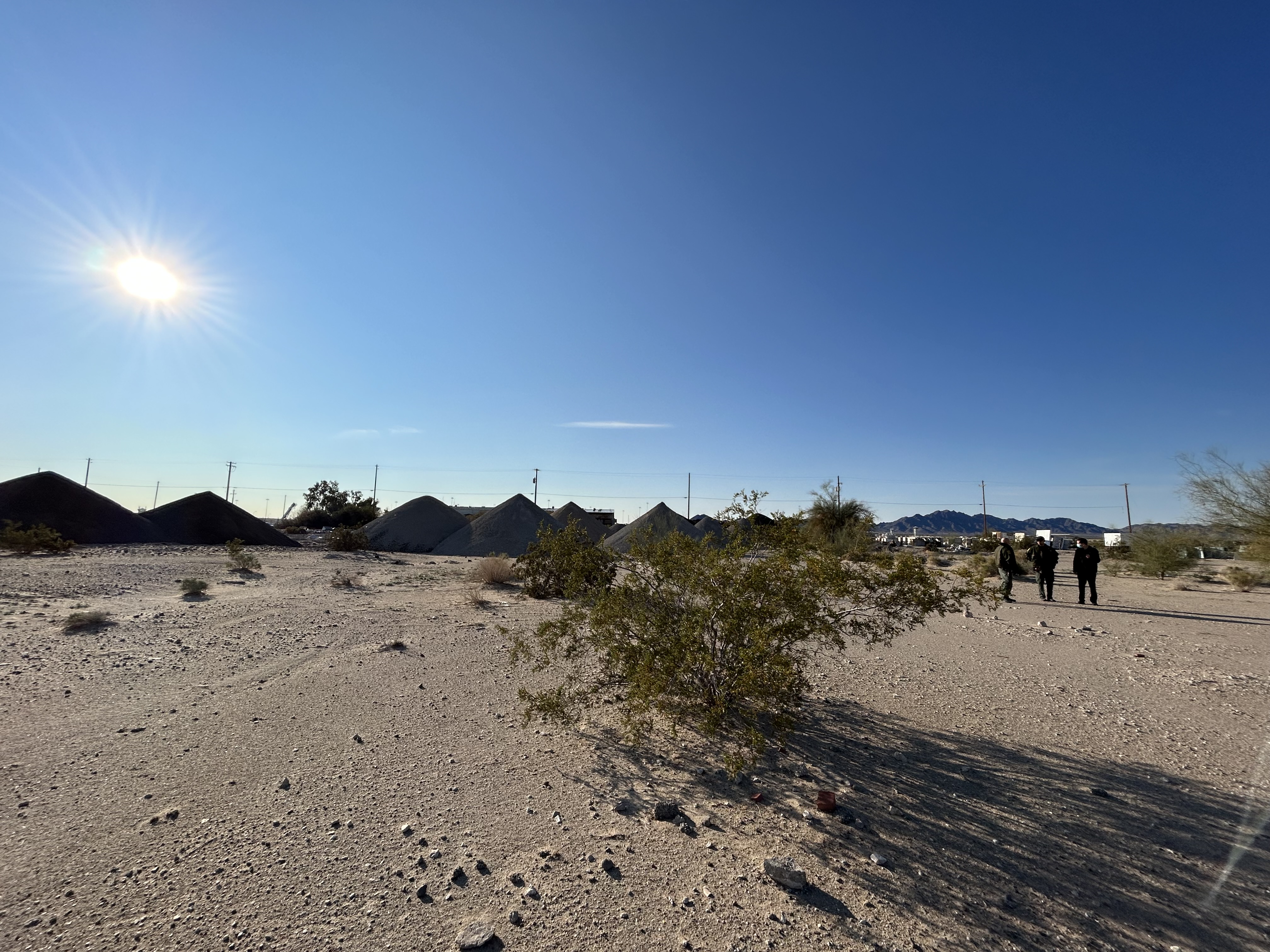 A wide desert field during a radar site survey