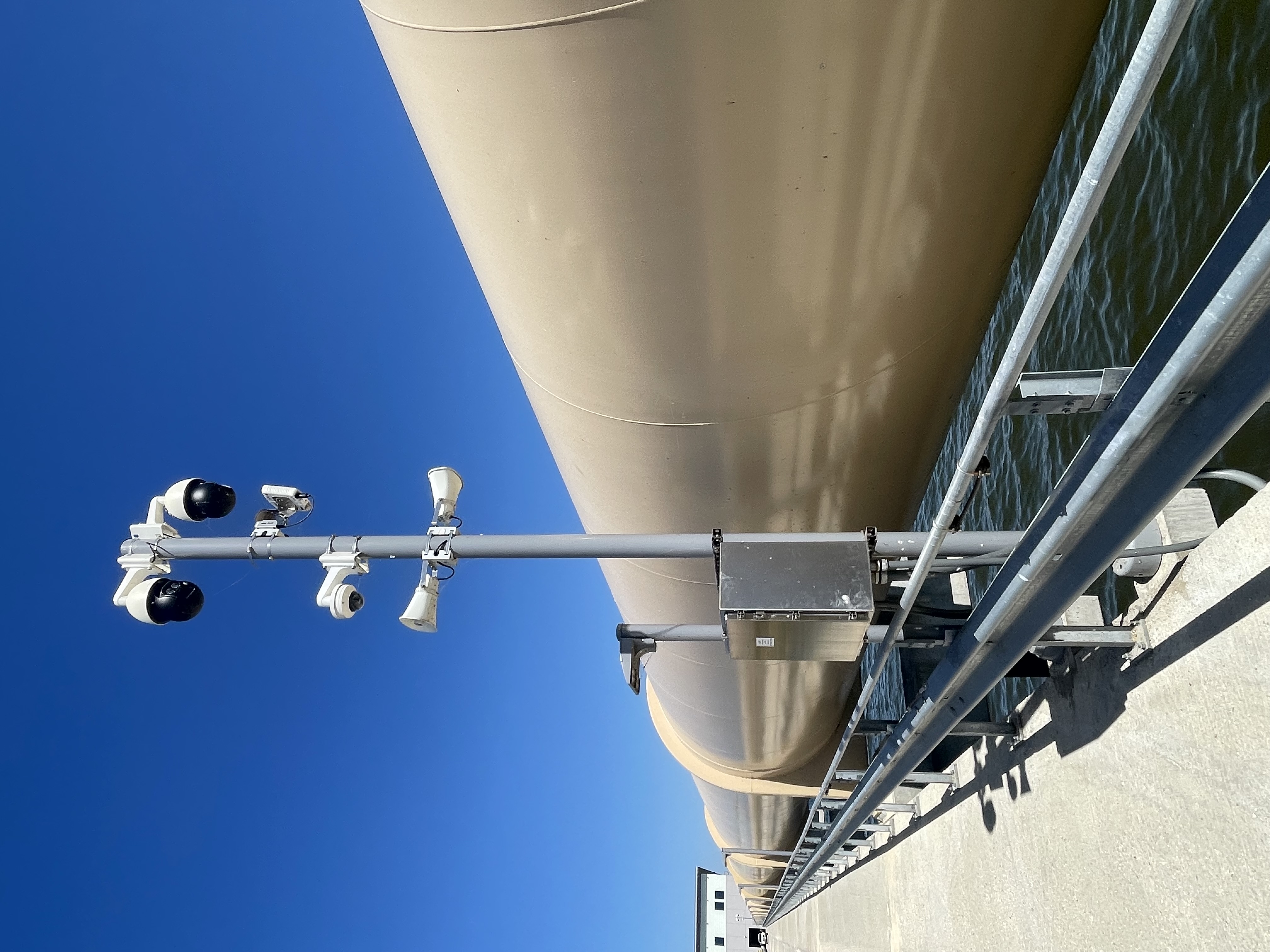 Security and sensing equipment installed beside large industrial infrastructure